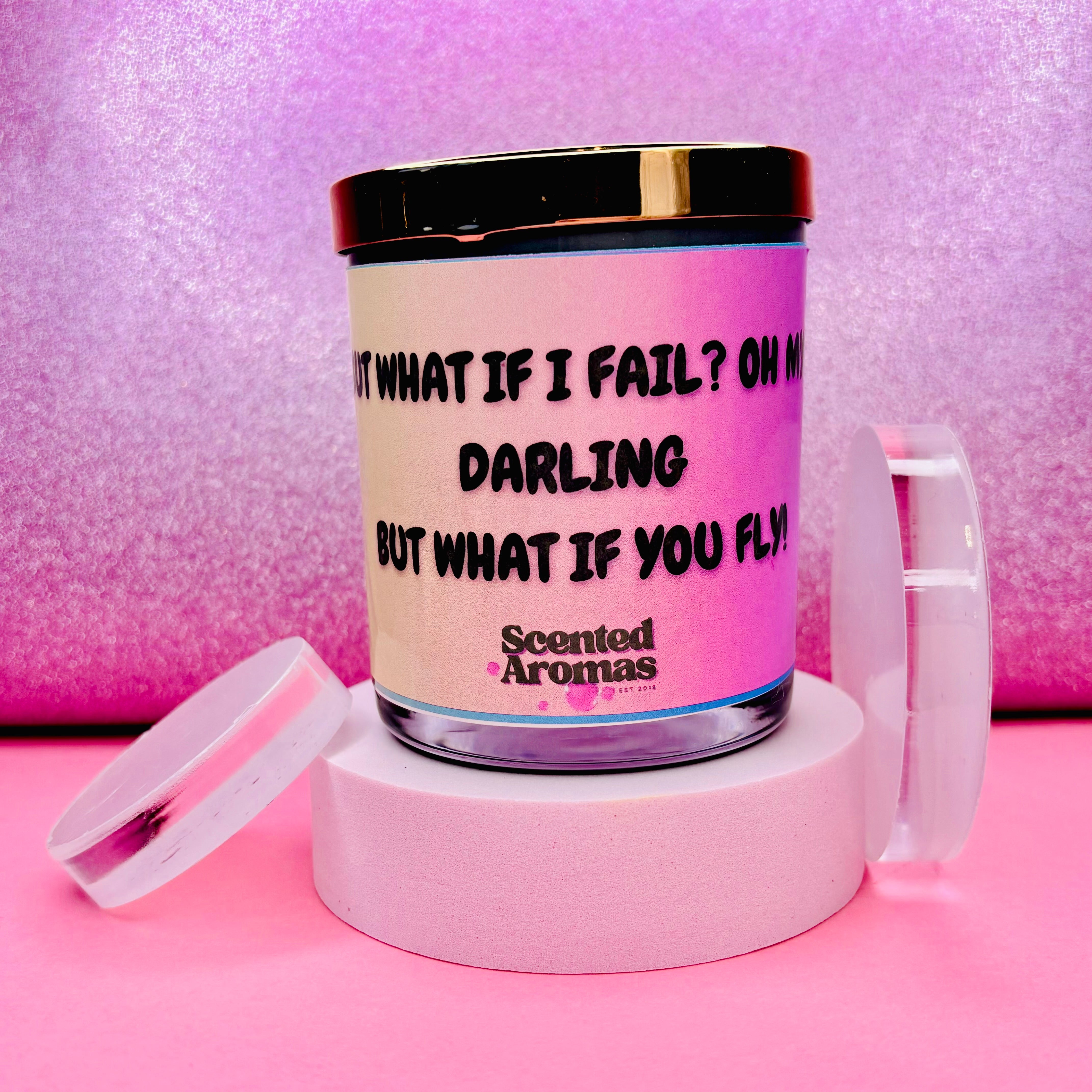 The Soap Gal x presents the "What If I Fail Positive Affirmation Quote Candle" (200g), featuring the inspiring message "What if I fail? Oh my darling, but what if you fly?" on its label, set against a pink gradient backdrop. Made from 100% pure soy wax, this candle promotes an empowering mindset with every flicker.