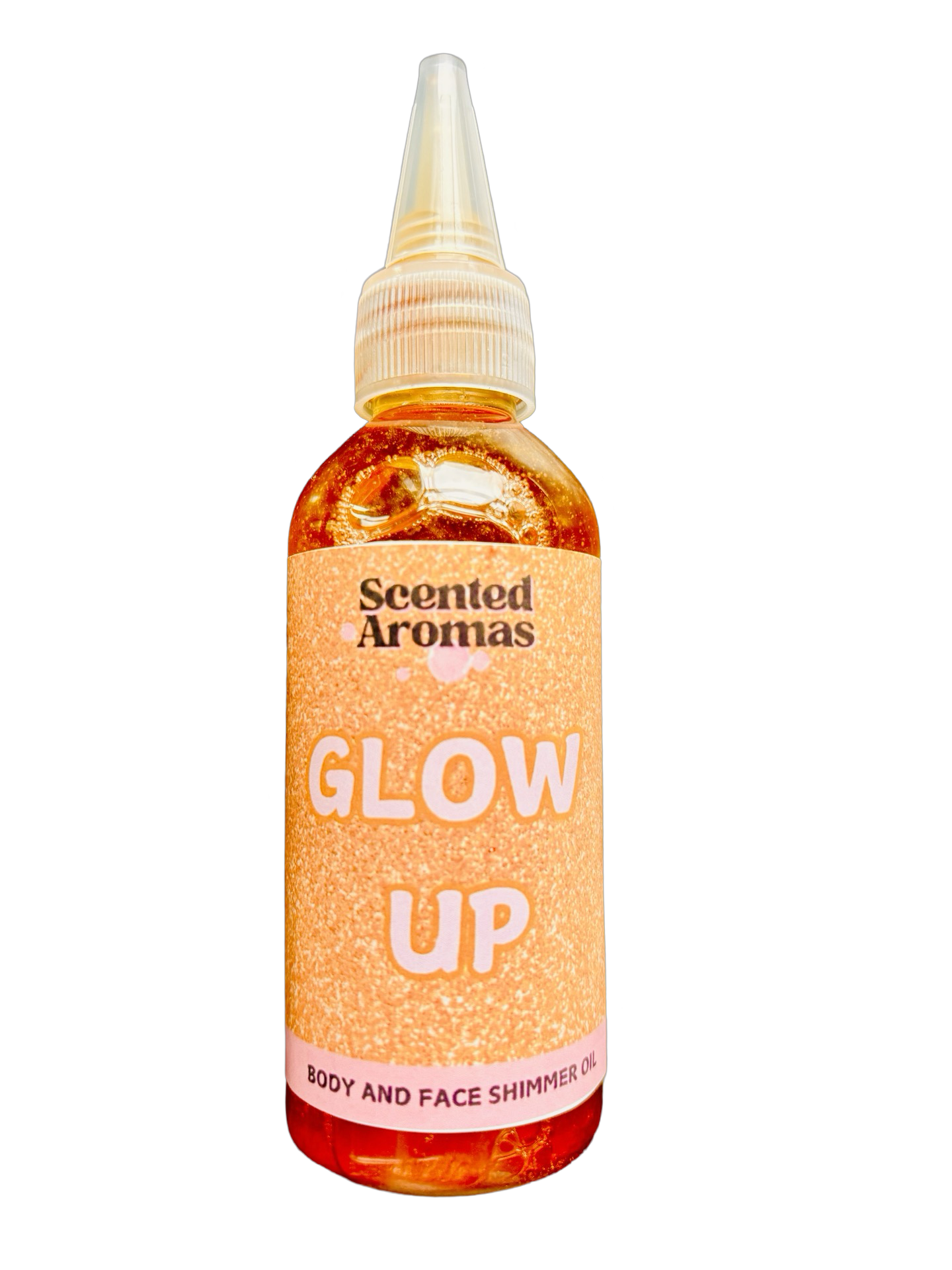 The "Glow Rituals Shimmering Body Oil 100ml" by Scented Aromas features a pointed applicator and provides a bronzed glow. The label is orange with a glittery design.