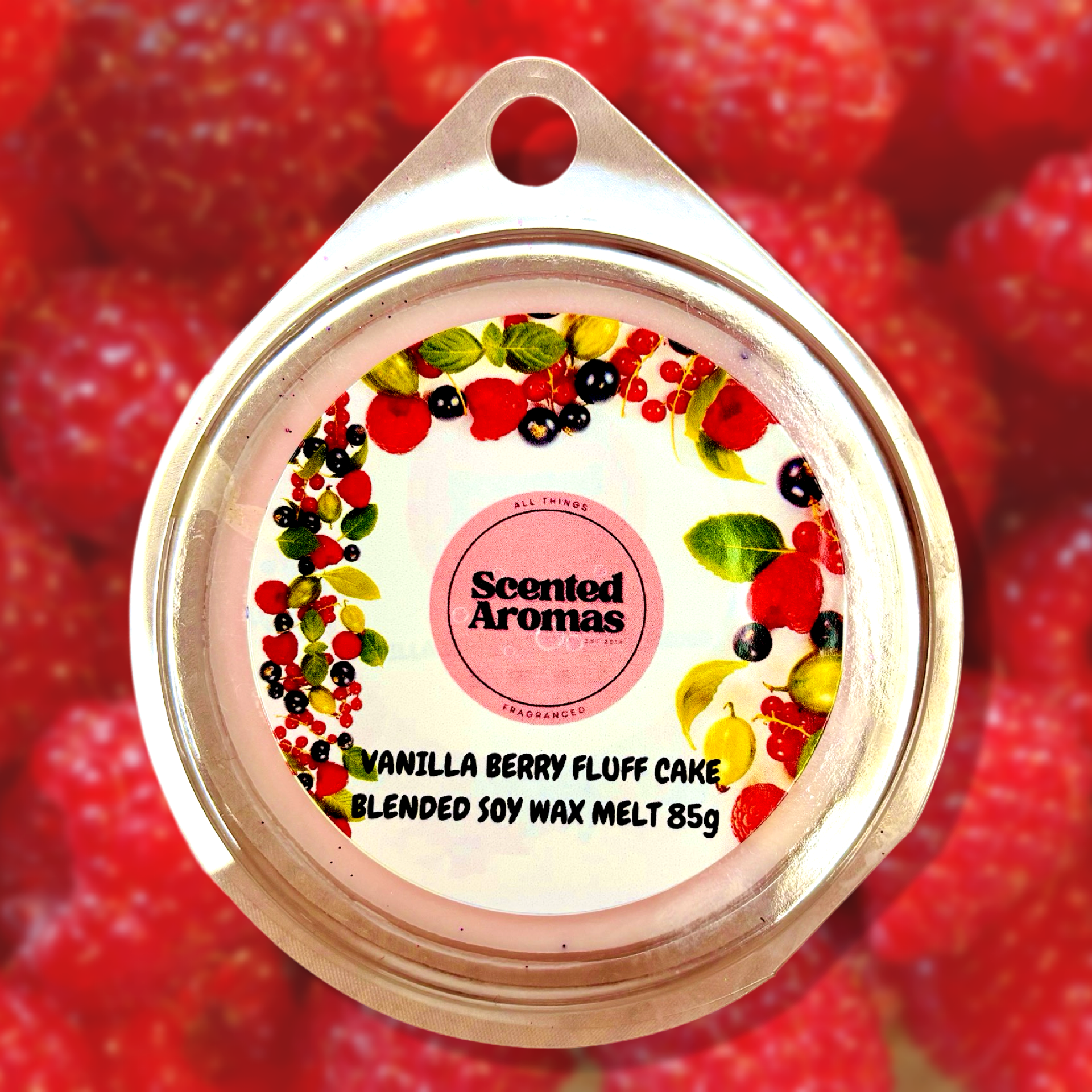 A round tin labeled "The Soap Gal x" showcases the alluring blend of "Vanilla Berry Fluff Cake Wax Melts 85g," adorned with vibrant fruit illustrations.