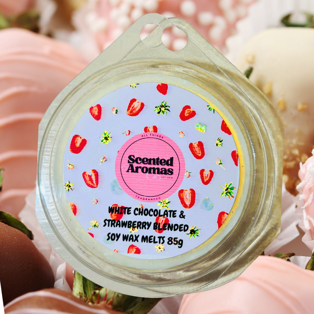 A package of The Soap Gal x's "White Chocolate Covered Strawberries Wax Melt 85g," adorned with pink and white sweets, promises a delightful fragrance experience.