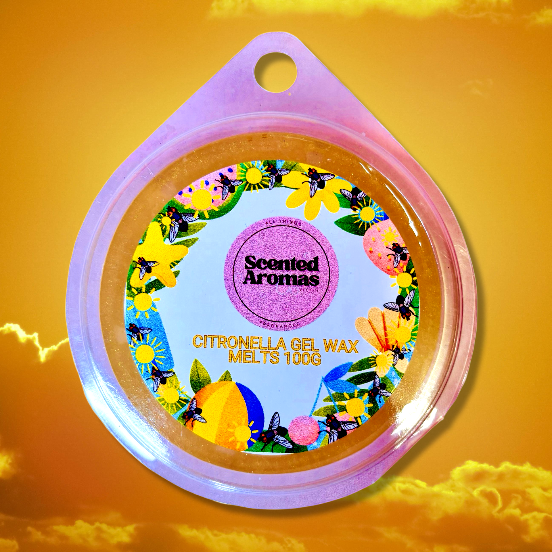 A round container of Citronella Bug Repellent Gel Wax Melts, 85g, from The Soap Gal x features a floral design label and is set against a bright sky background. This natural bug preventer, infused with essential oils, makes for both an attractive and functional addition to your outdoor space.