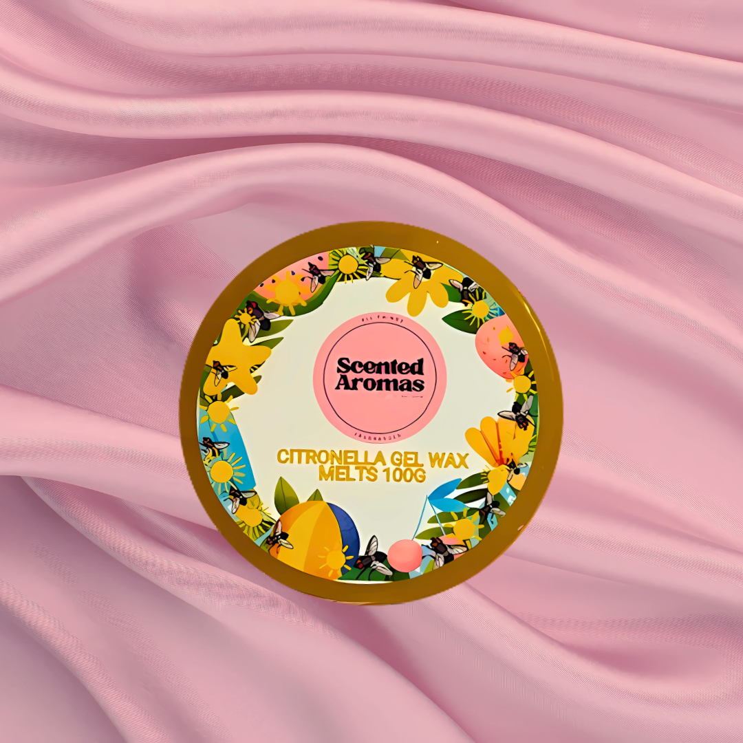 A round container of Citronella Bug Repellent Gel Wax Melts 85g from The Soap Gal x is placed on a pink fabric background. Infused with 100% pure essential oils, these melts are an effective natural bug deterrent, ideal for creating a welcoming environment free of any unwelcome pests.