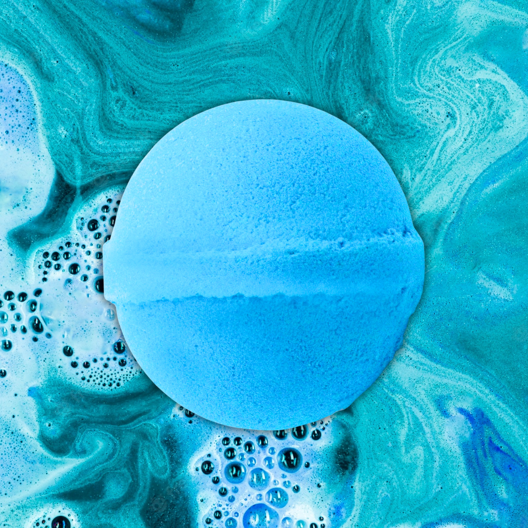 The Soap Gals' Savage Aftershave Bath Bomb melts into turquoise waters, releasing bubbles and swirls of white foam. Inspired by a famous perfume, this luxurious bath bomb turns your bath into a fragrant oasis.