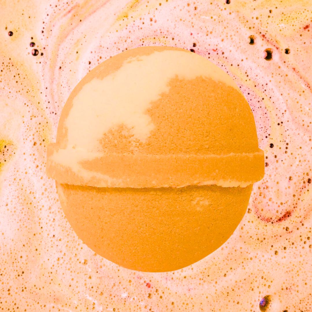 Introducing the Feeling Peachy Bath Bomb by The Soap Gal x—a spherical, orange indulgence nestled in a lively pink and orange fizzy setting. Dive into its luscious peach aroma while savoring a vegan and cruelty-free bath experience.