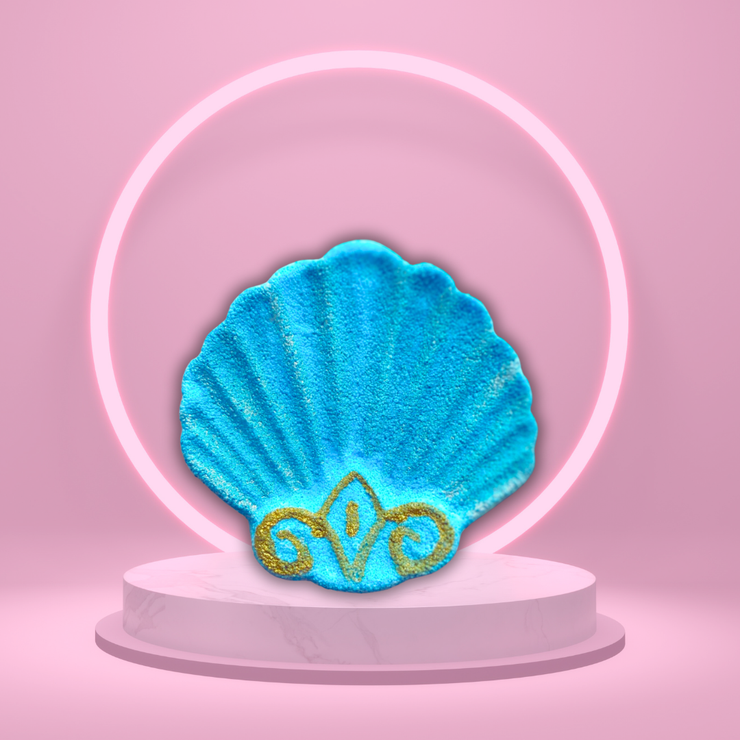 A stunning bright blue shell-shaped bath bomb with decorative gold accents sits elegantly on a round white pedestal. A glowing neon circle frames the shell, set against a pink background, evocative of the enchanting Fiji fragrance from our Magical Skincare and Home Fragrance collection. This is "She Sells Sea Shells On The Sea Shore Bath Bomb" by The Soap Gal x.