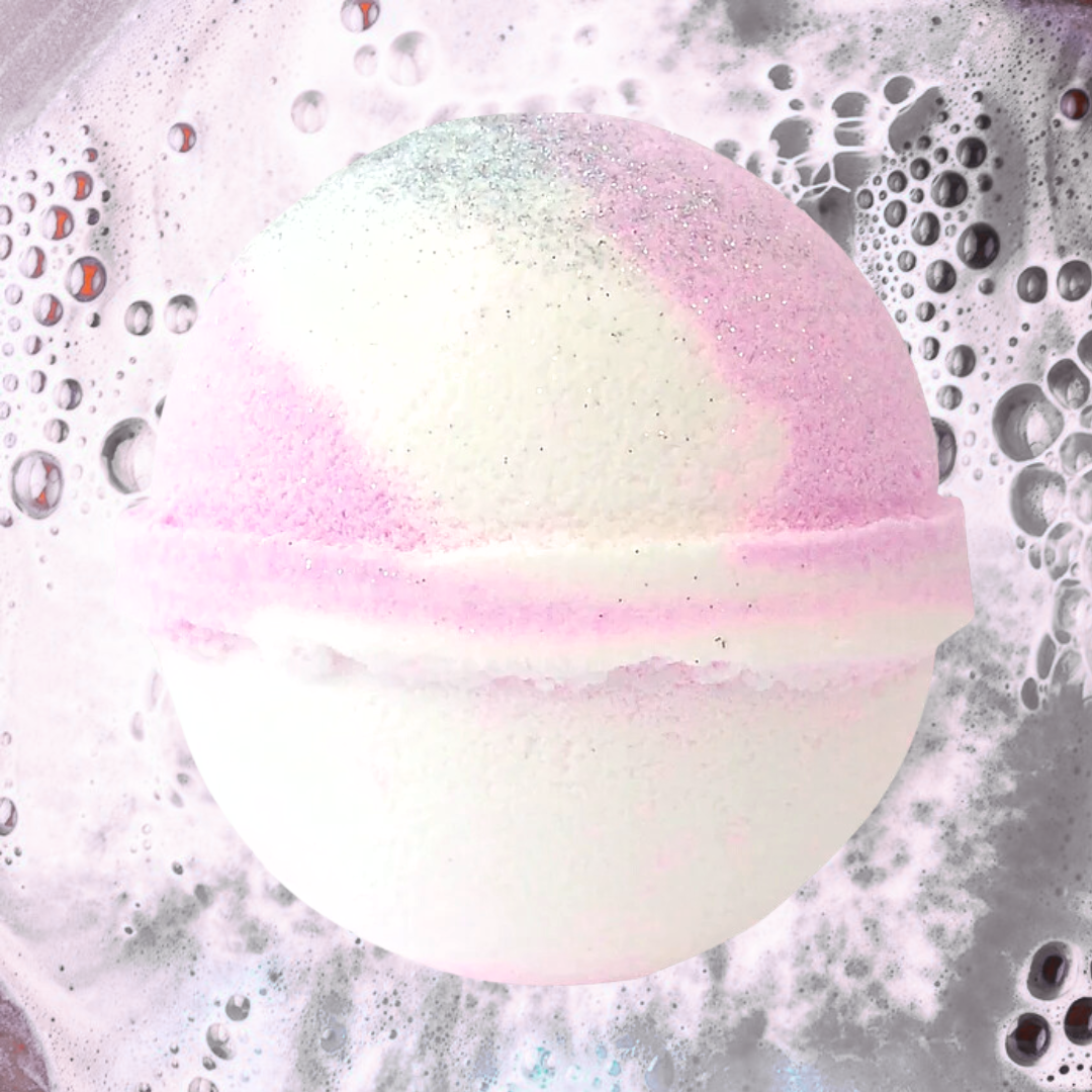 The Coconut Dream Jumbo Bath Bomb by The Soap Gal x, enriched with shea butter, dissolves in water to create bubbles and a frothy, glittering effect.