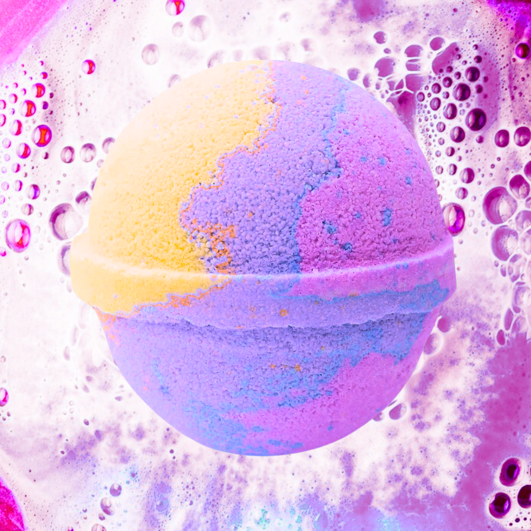 Indulge in The Soap Gals' Raspberry Lemonade Bath Bomb, a vegan treat featuring pink, purple, and yellow tones. Enjoy its sweet aroma as it transforms your bath with lively swirling water and bubbles.